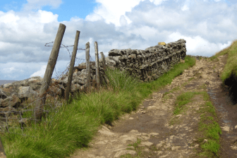 A stony track leads uphill on the Pennine Way.